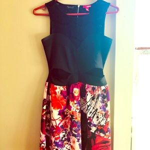 Cute cutout and lace back cocktail dress.